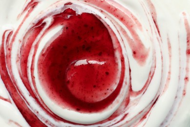 Photo of Tasty yoghurt with jam as background, top view