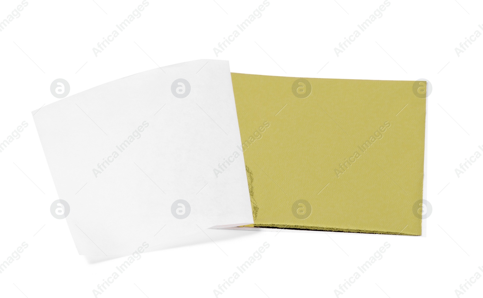 One edible gold leaf sheet isolated on white Photo of One edible gold leaf sheet isolated on white