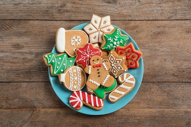 Photo of Tasty homemade Christmas cookies on wooden table, top view