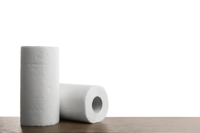 Photo of Rolls of paper tissues on wooden table