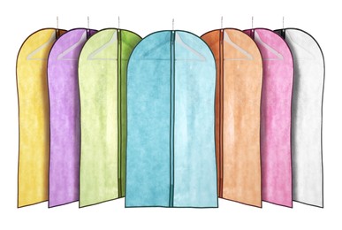 Image of Set with different garment bags for clothes on white background 