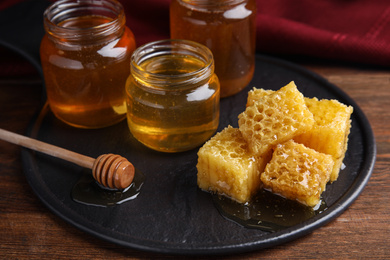 Photo of Composition with fresh delicious honey on wooden table