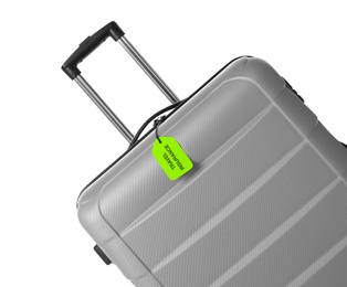 Photo of Grey suitcase with TRAVEL INSURANCE label on white background