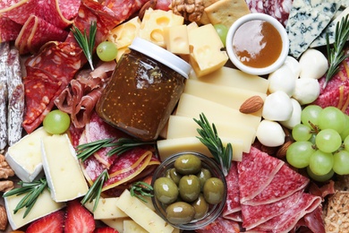 Photo of Tasty assorted appetizers as background, top view