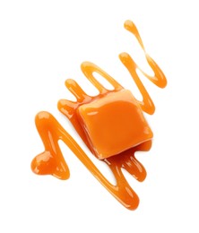 Photo of Sweet caramel candy with topping isolated on white, top view