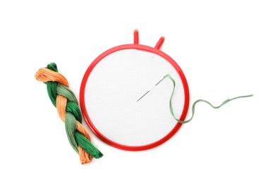 Photo of Set of embroidery equipment on white background, top view