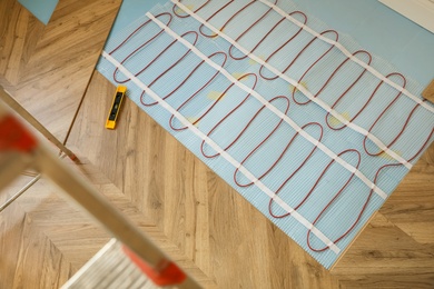Photo of Installation of electric underfloor heating system indoors, above view