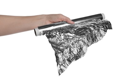 Photo of Woman holding roll of foil paper on white background, closeup