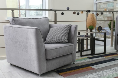 Photo of Stylish living room interior with comfortable armchair