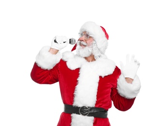Photo of Santa Claus singing into microphone on white background. Christmas music