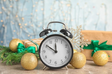 Photo of Alarm clock and decorations on table. Christmas countdown