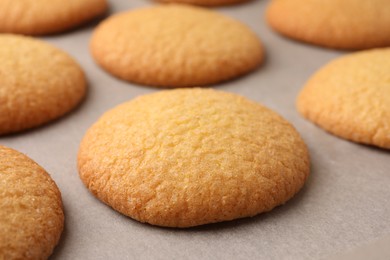 Photo of Delicious Danish butter cookies on baking tray, closeup