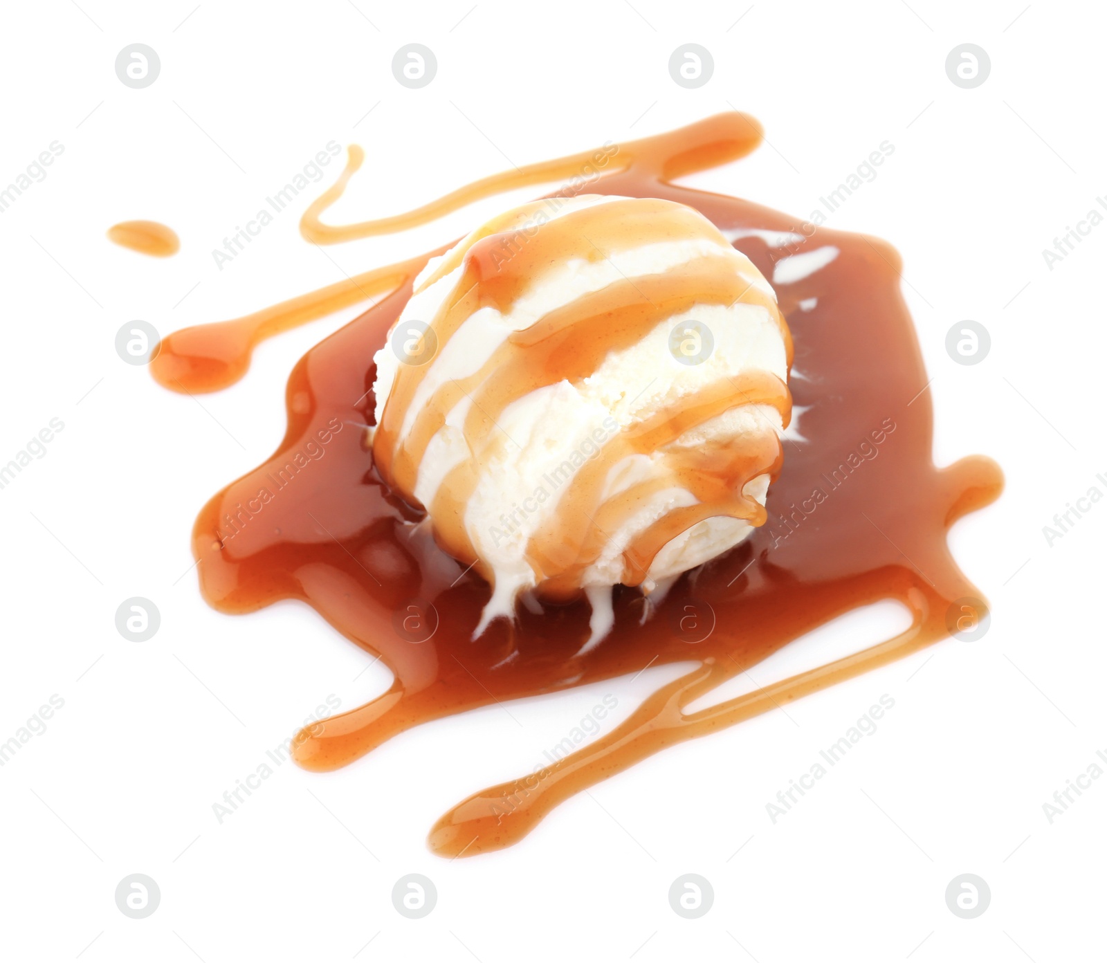 Photo of Ball of tasty vanilla ice cream with caramel topping on white background