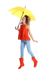 Photo of Woman with yellow umbrella on white background
