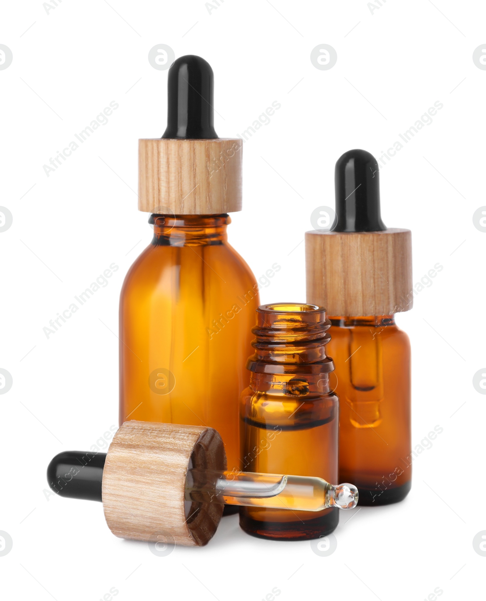 Photo of Bottles of essential oil and dropper on white background