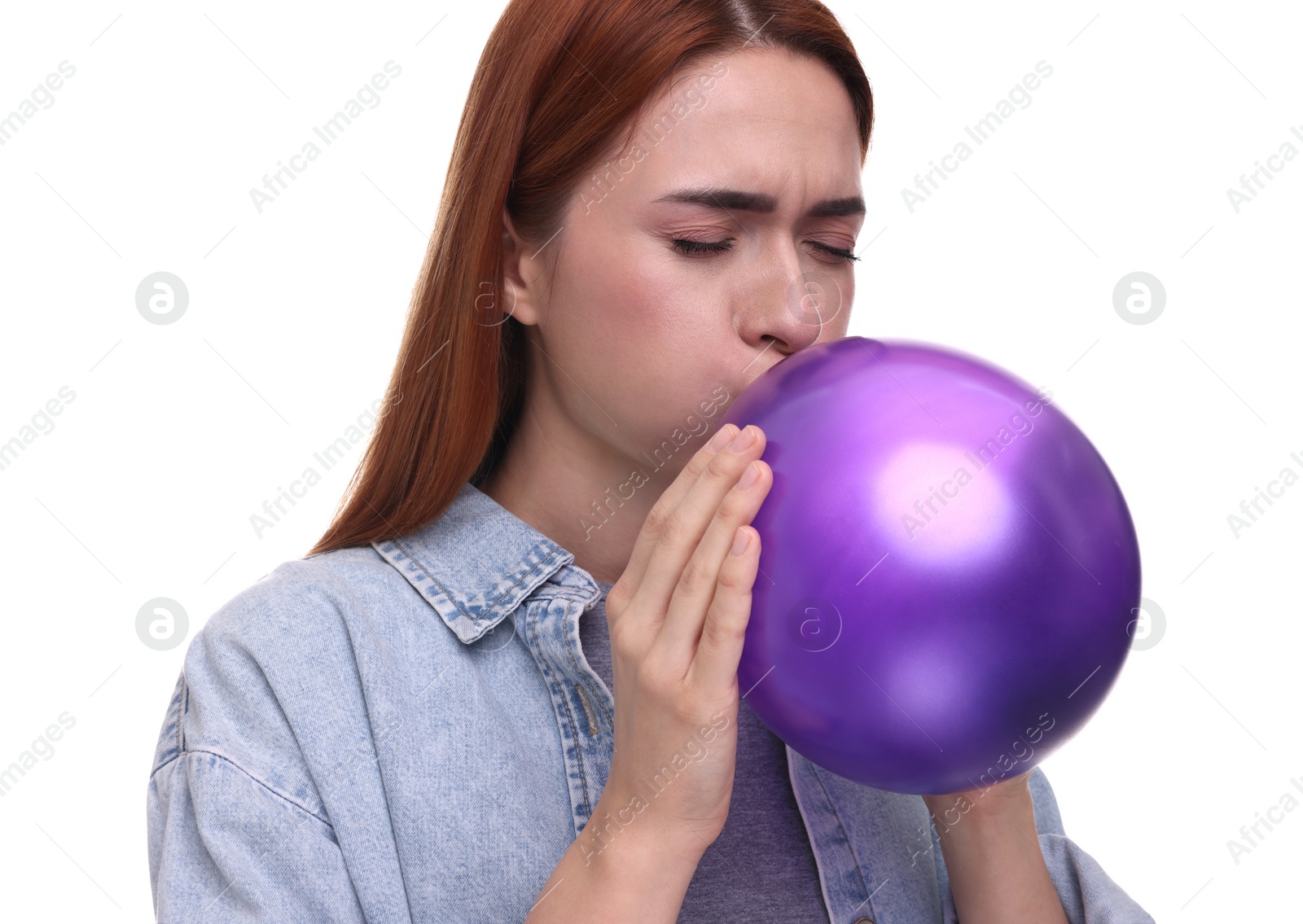 Photo of Woman inflating purple balloon on white background