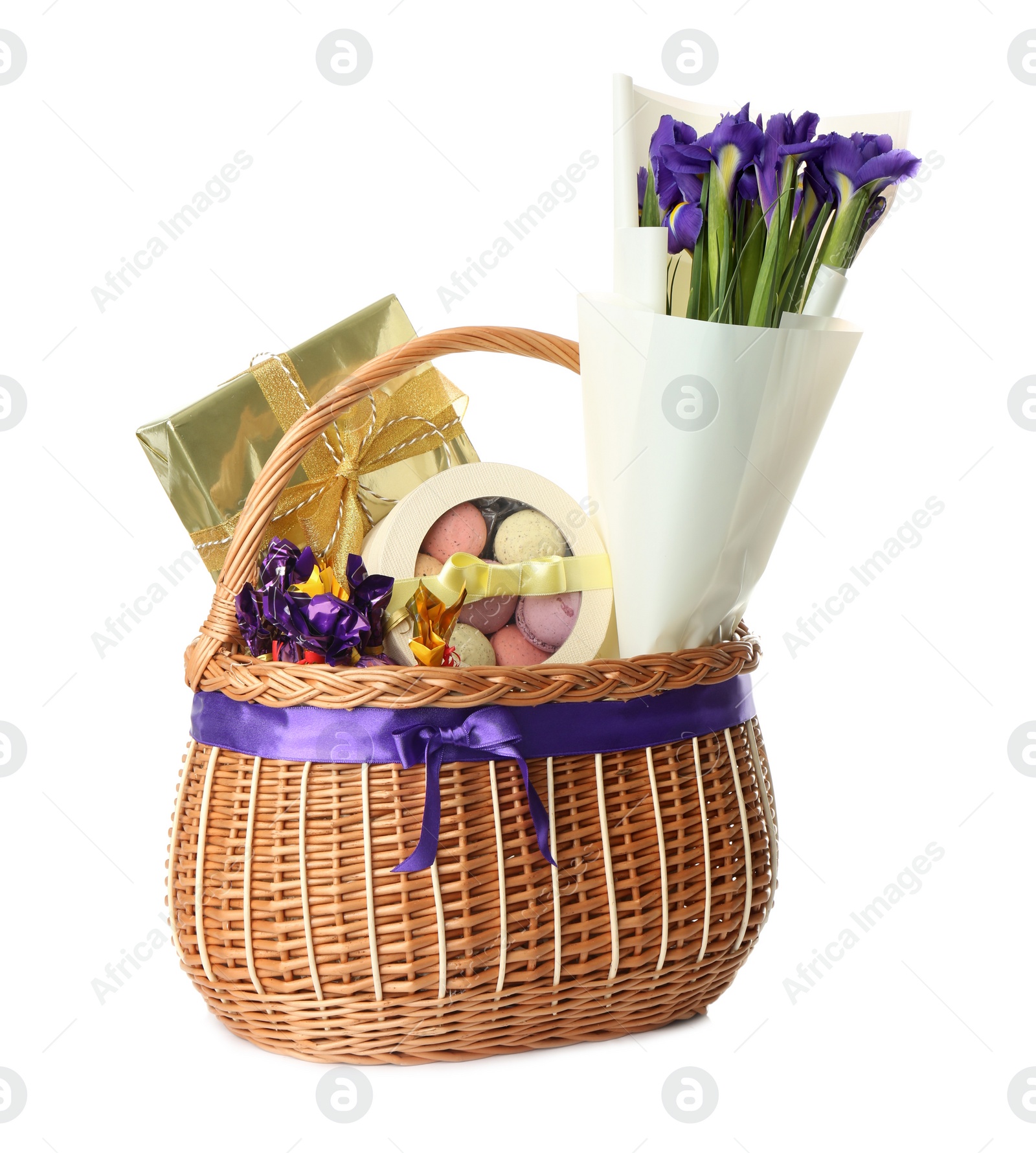 Photo of Wicker basket full of presents isolated on white