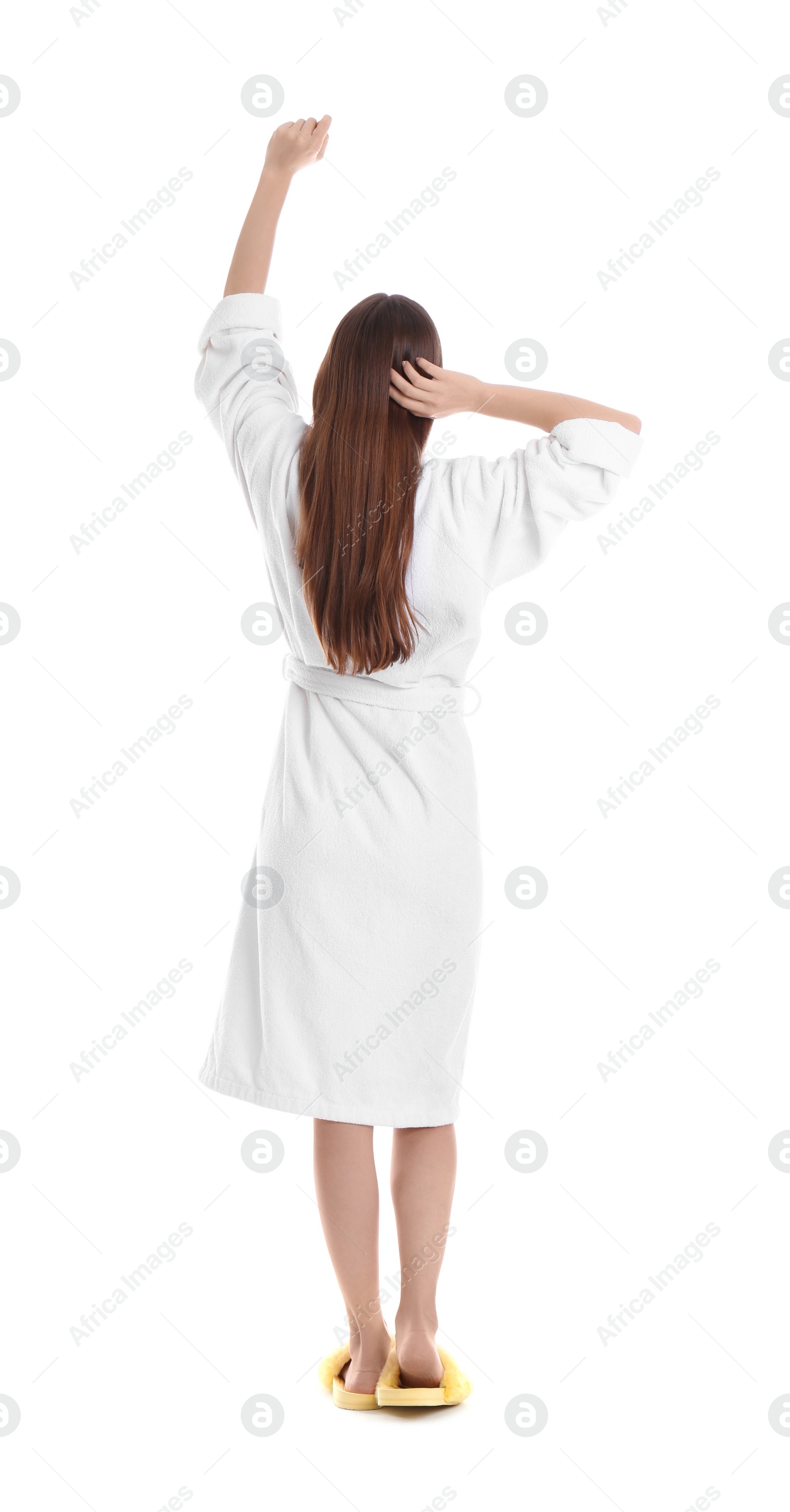 Photo of Young woman in bathrobe on white background