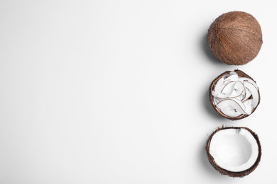 Photo of Composition with fresh coconut flakes on white background, top view