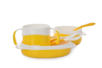 Photo of Set of plastic dishware on white background. Serving baby food