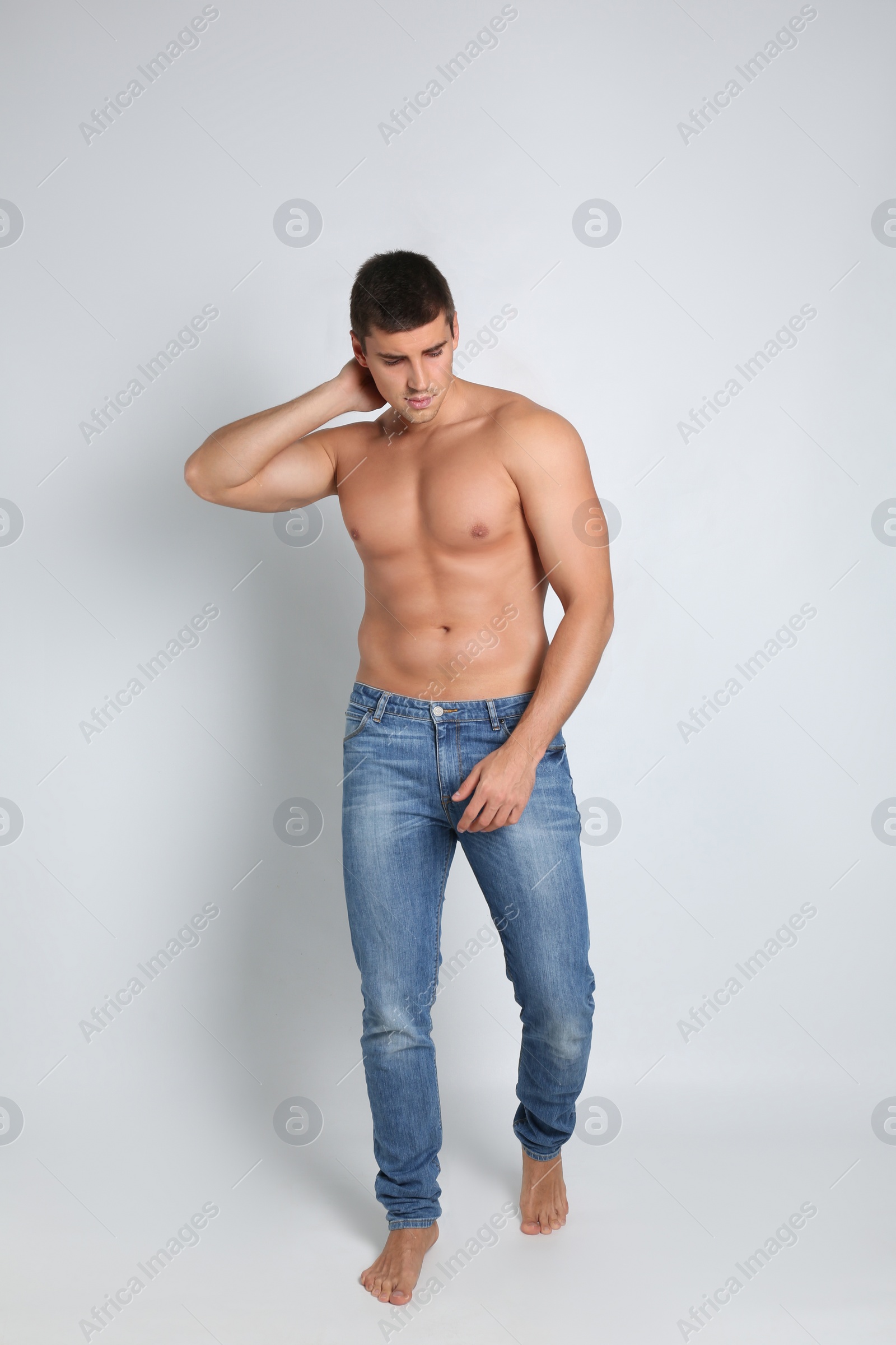 Photo of Man with sexy body on light background