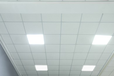 Photo of White ceiling with lighting in office room