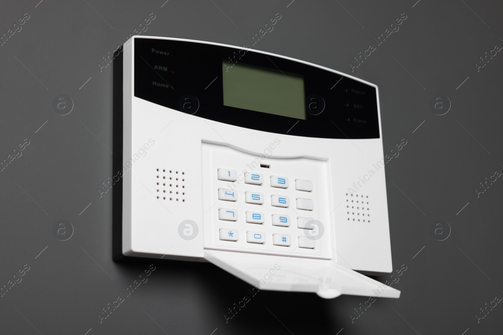 Photo of Home security alarm system on gray wall