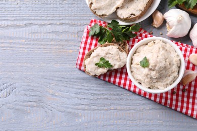Lard spread served with bread on light grey wooden table, flat lay. Space for text