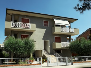 Beautiful residential house with yard on sunny day