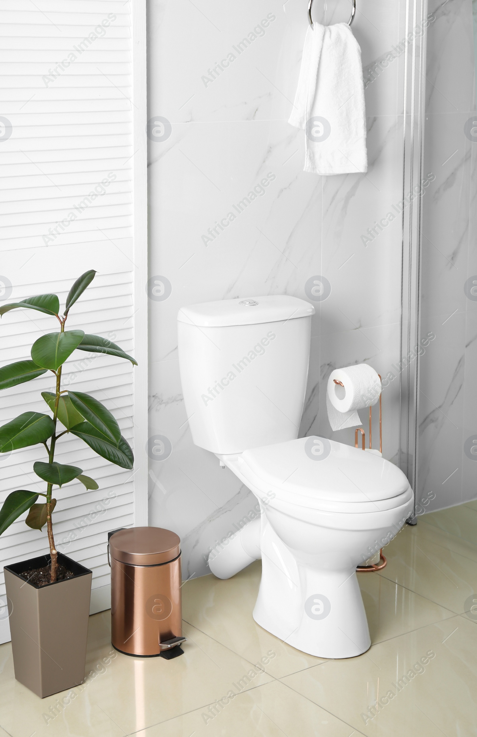 Photo of Ceramic toilet bowl in modern bathroom interior