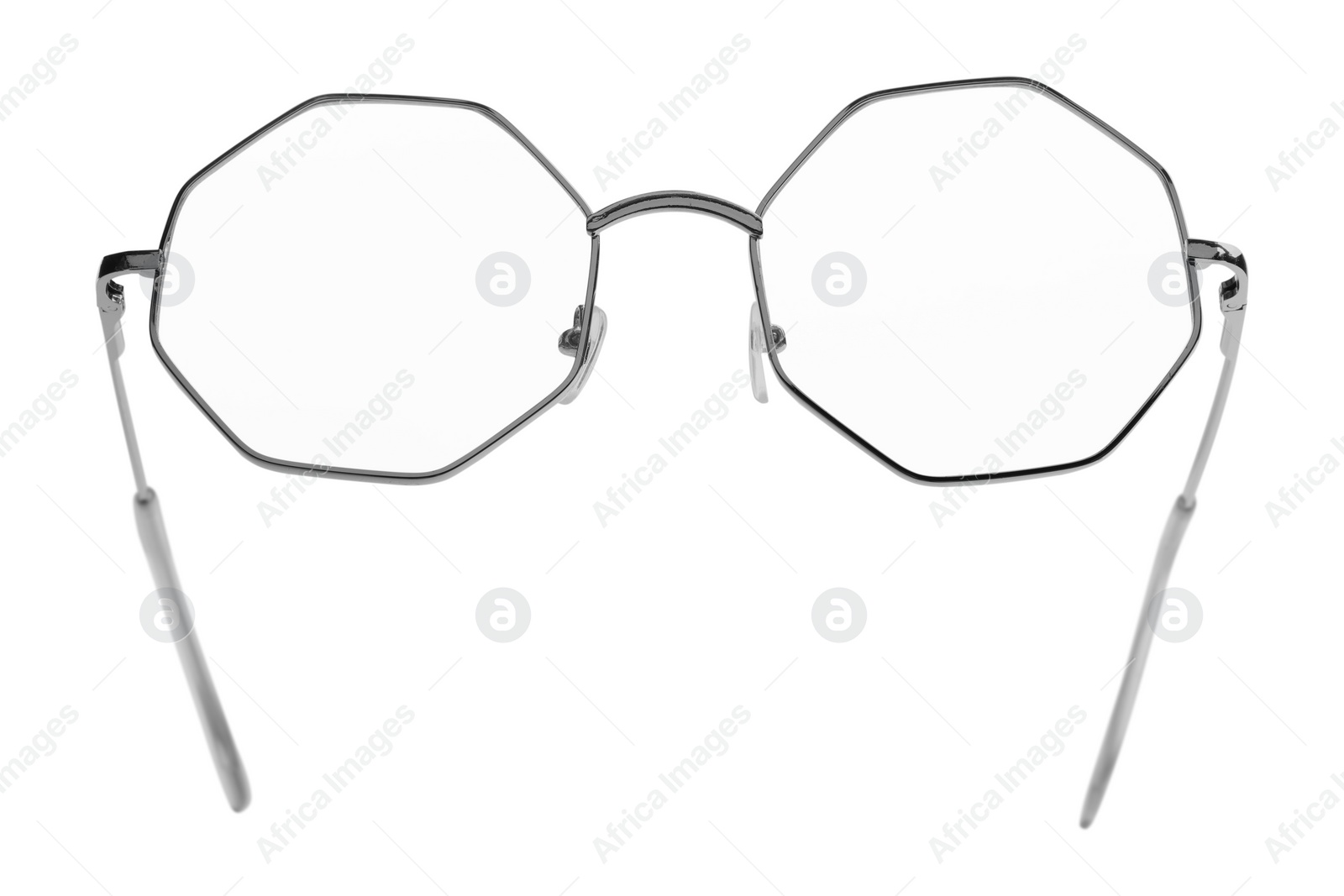 Photo of Stylish glasses with metal frame isolated on white