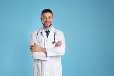 Photo of Pediatrician with stethoscope on light blue background. Space for text