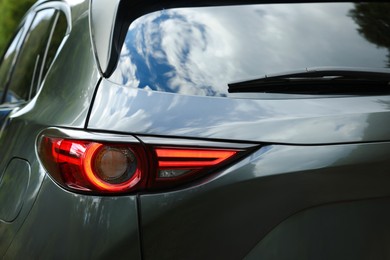 Photo of Closeup view of new black modern car