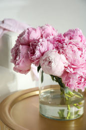 Bouquet of beautiful peonies on table indoors
