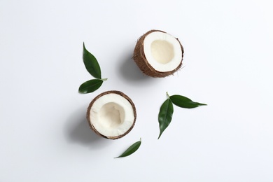 Composition with coconuts on white background, top view