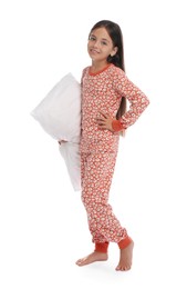 Photo of Cute girl wearing pajamas with pillow on white background