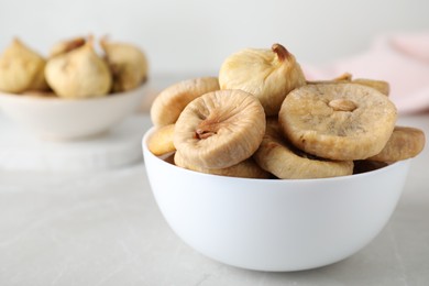 Photo of Tasty dried figs on light grey table