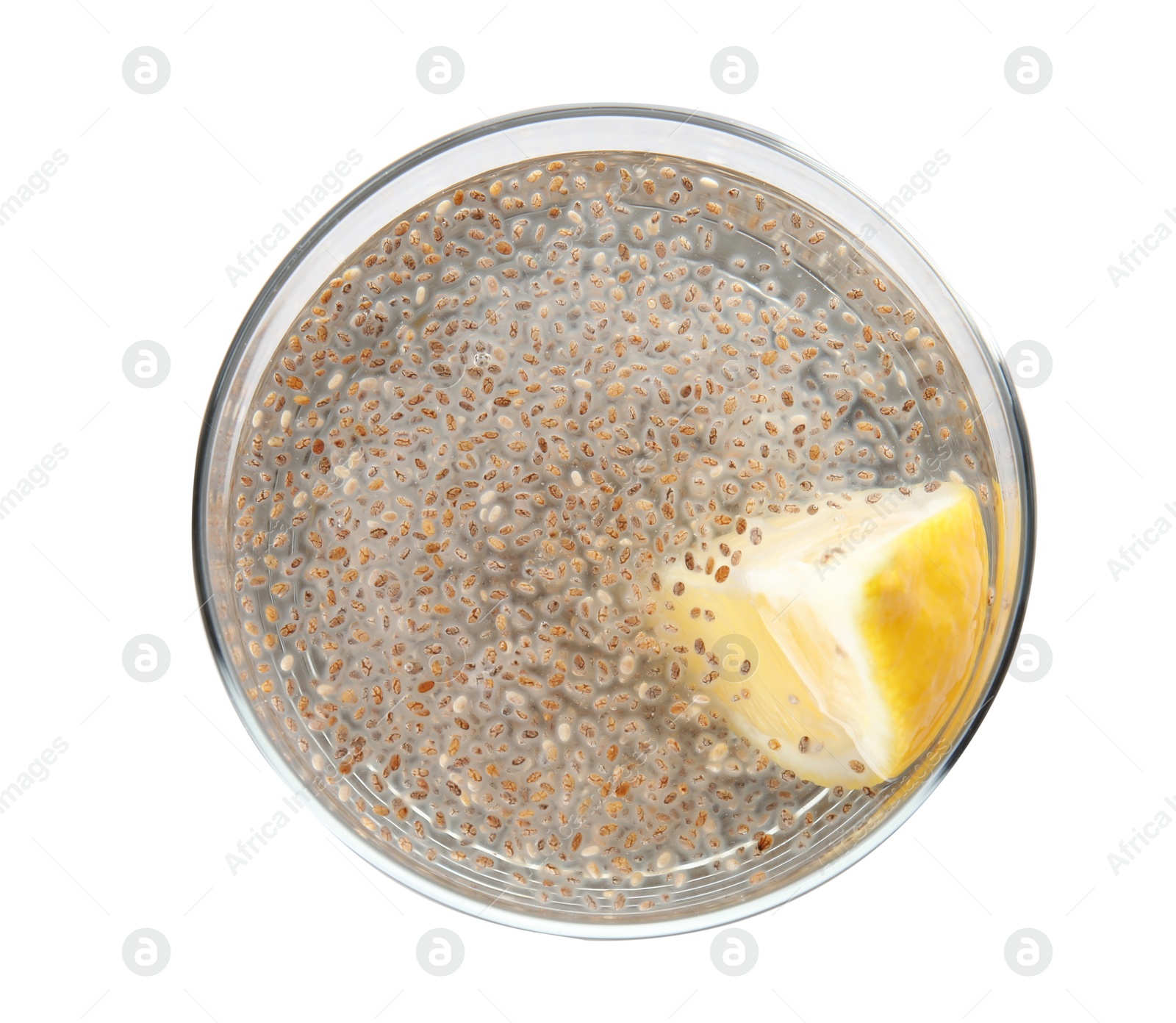 Photo of Glass of water with chia seeds on white background, top view