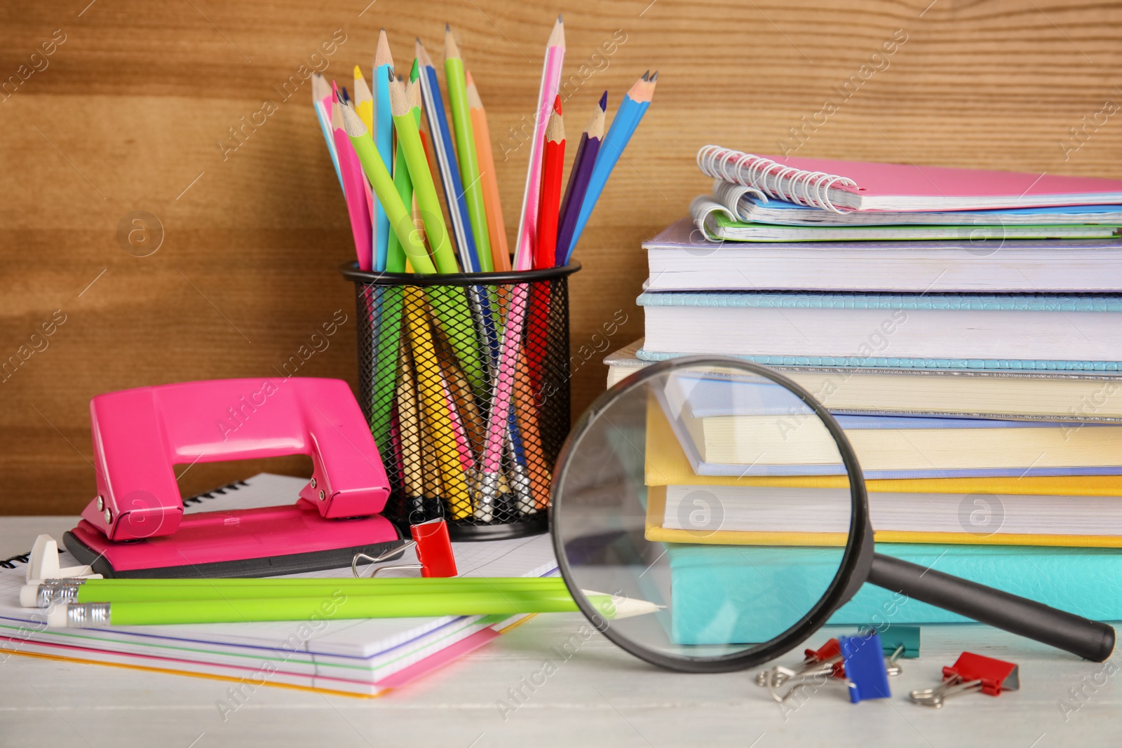 Photo of Different stationery on wooden table. Back to school