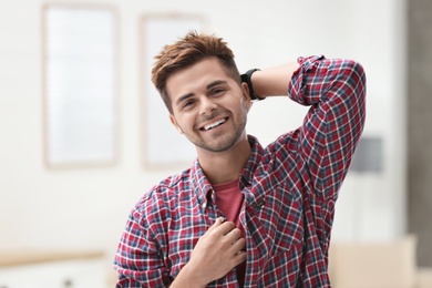 Photo of Portrait of handsome young man in room