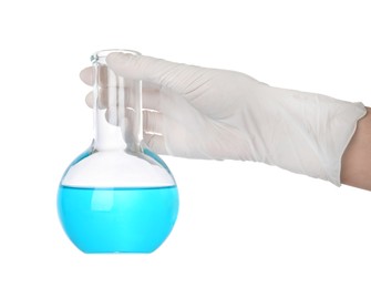 Photo of Scientist in gloves holding laboratory flask with light blue liquid on white background, closeup