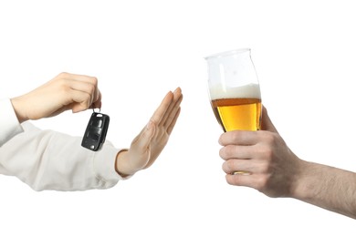 Photo of Woman with car keys refusing alcohol while man suggesting her beer on white background, closeup. Don't drink and drive concept