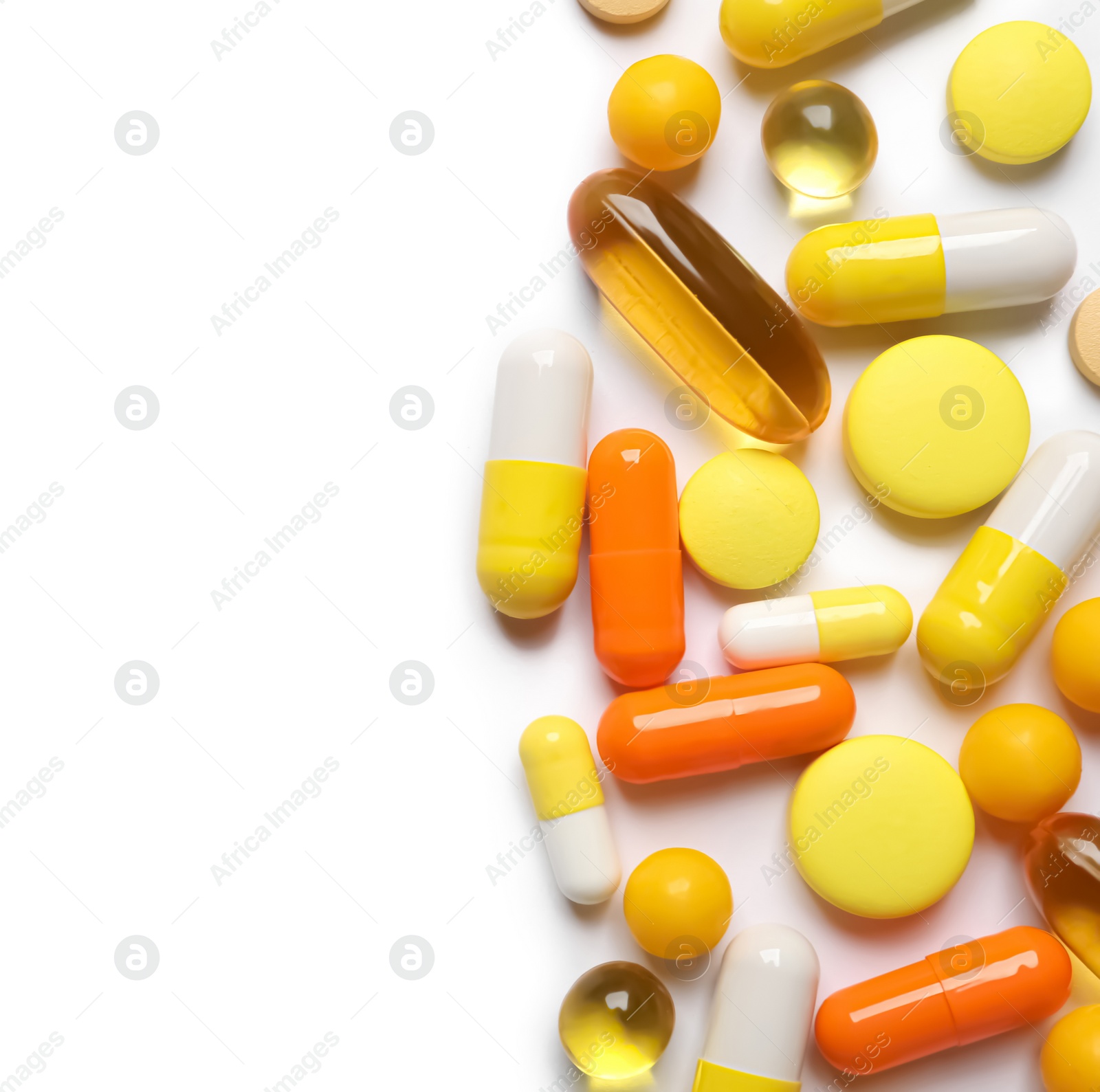 Photo of Lots of different colorful pills isolated on white, top view