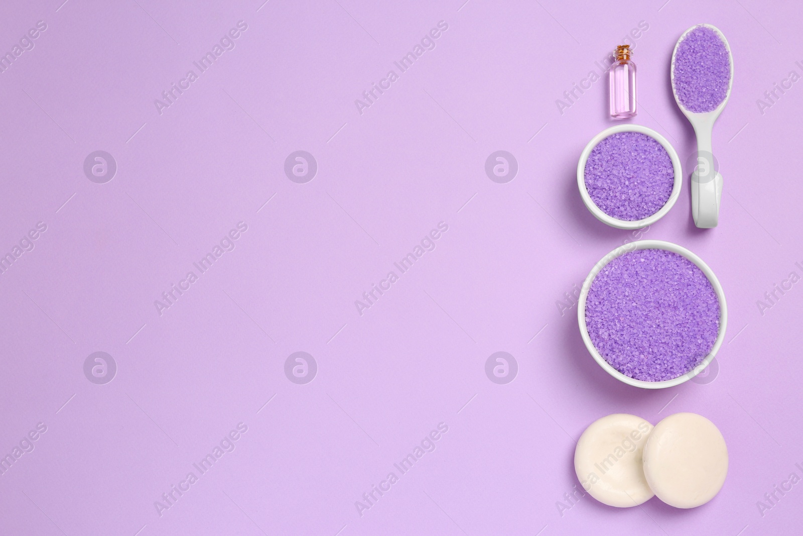 Photo of Flat lay composition with aromatic sea salt on purple background. Space for text