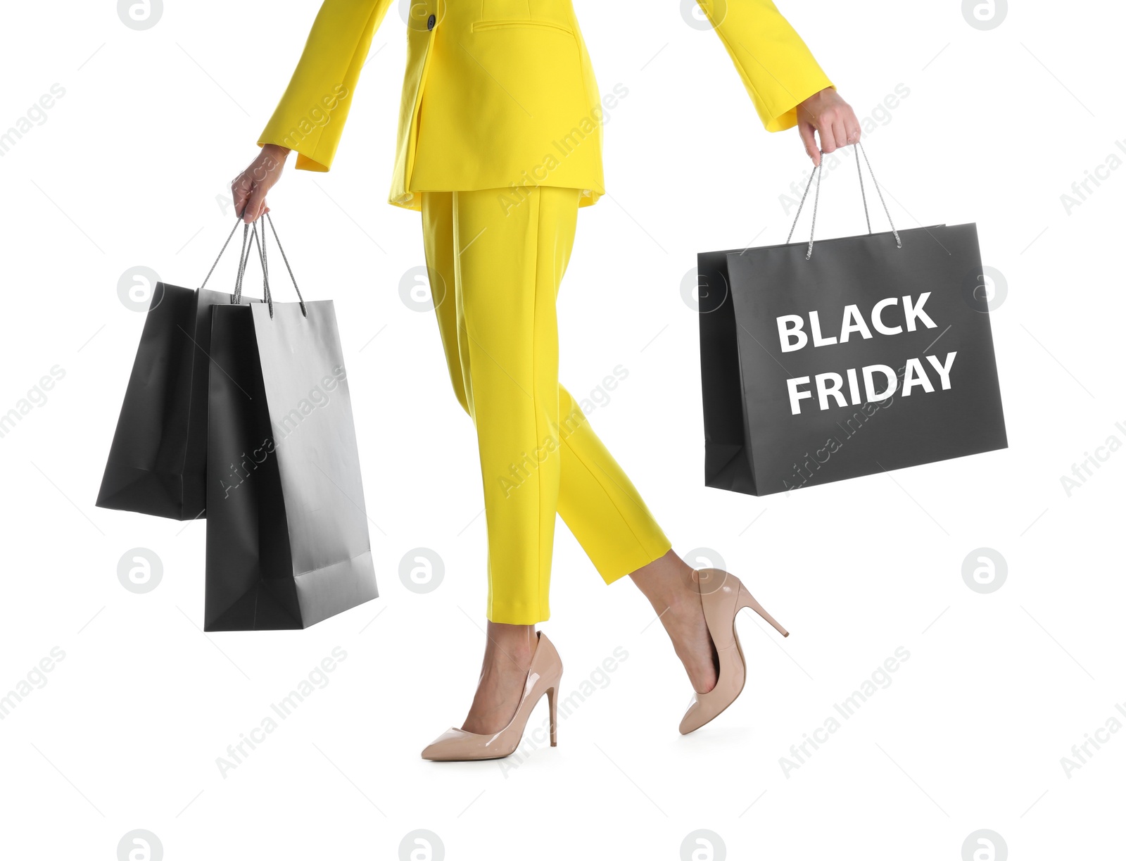 Photo of Woman with shopping bags on white background, closeup. Black Friday Sale