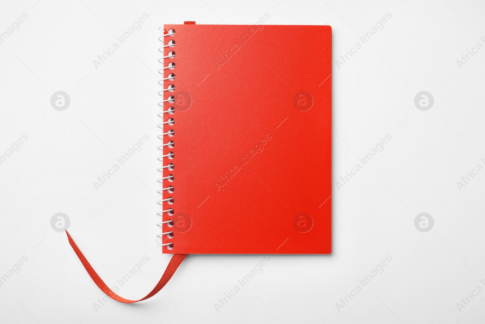 Photo of Stylish red notebook isolated on white, top view