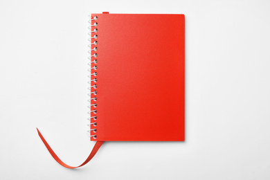 Photo of Stylish red notebook isolated on white, top view