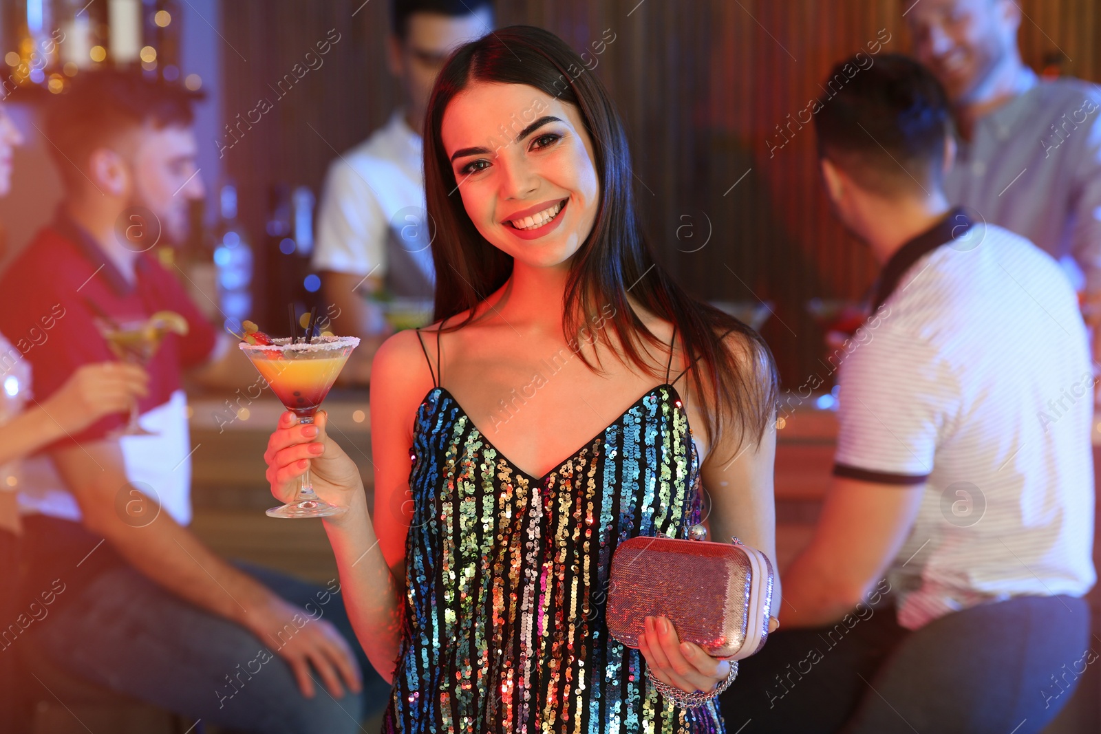 Photo of Beautiful young woman with glass of martini cocktail in bar