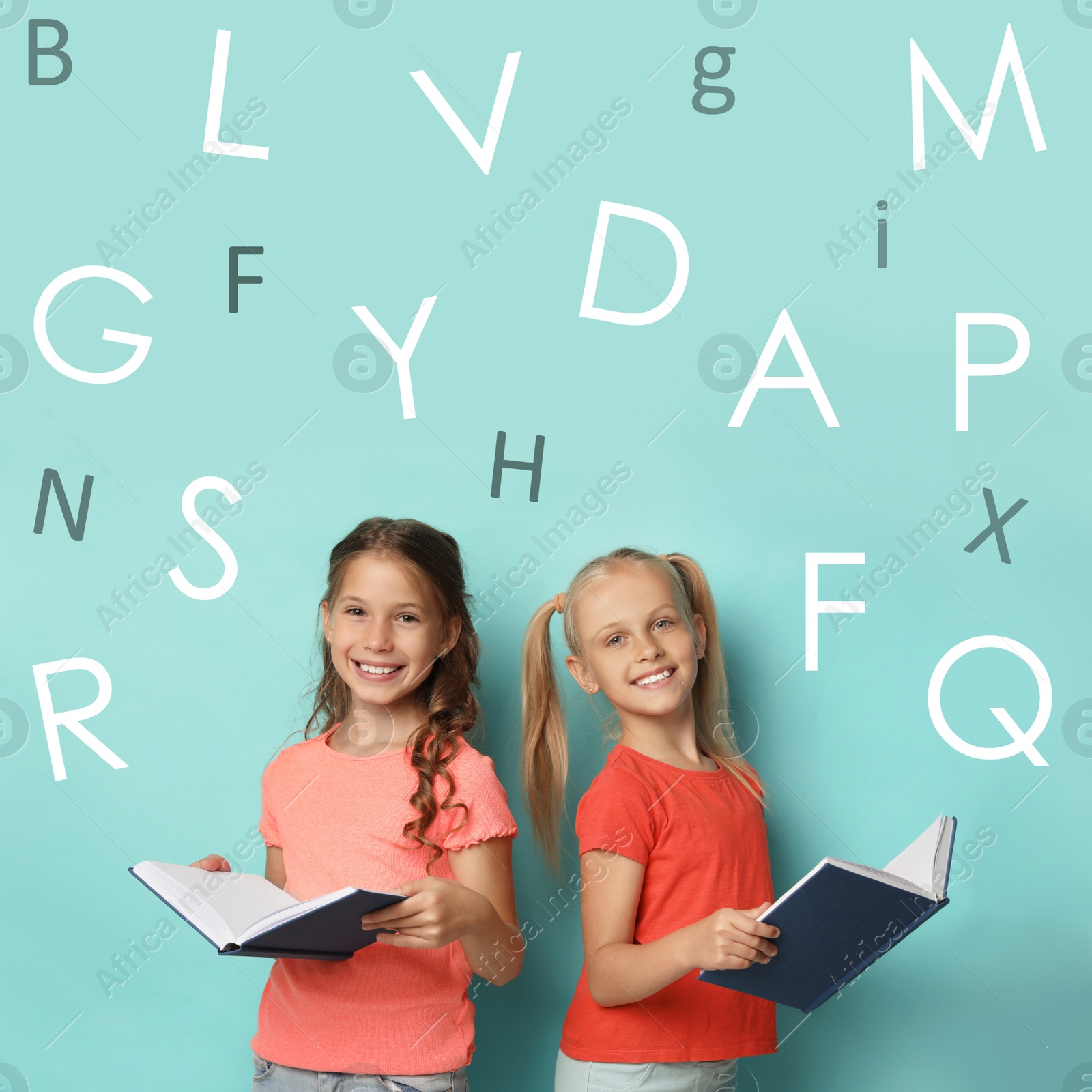 Image of Little girls reading books on turquoise background