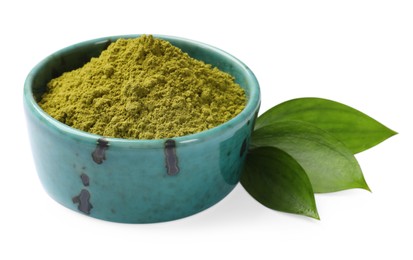 Photo of Henna powder in bowl and green leaves isolated on white